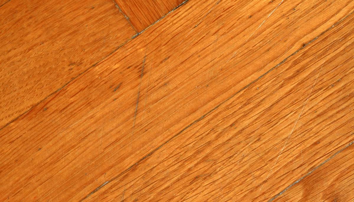 Bar chart showing causes of wood floor installation failures: 23% adhesive issues, 18% subfloor prep, 15% moisture, 12% acclimation, 32% other