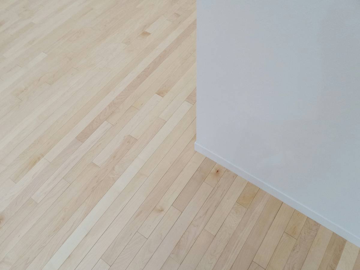 Peel-and-stick adhesive flooring solutions no mess installation in progress showing clean workspace