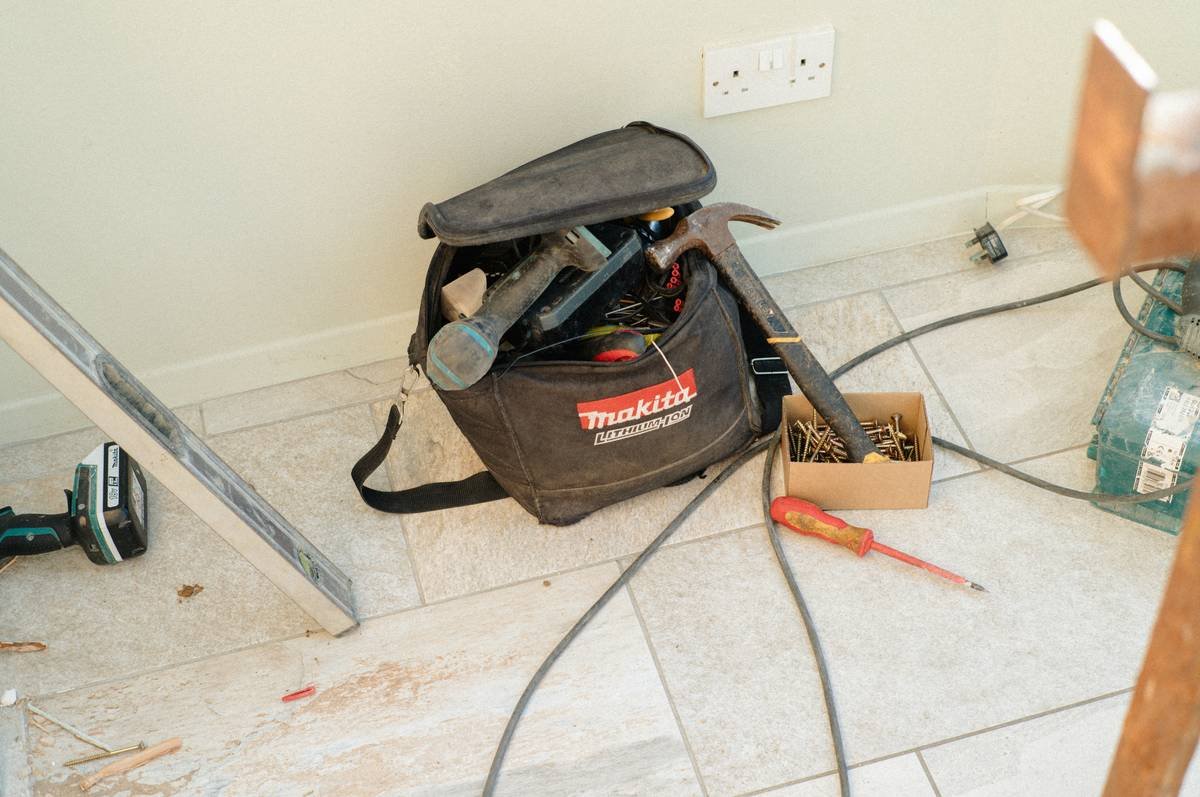 adhesive flooring solutions quick installation in progress showing centered layout and staggered joints